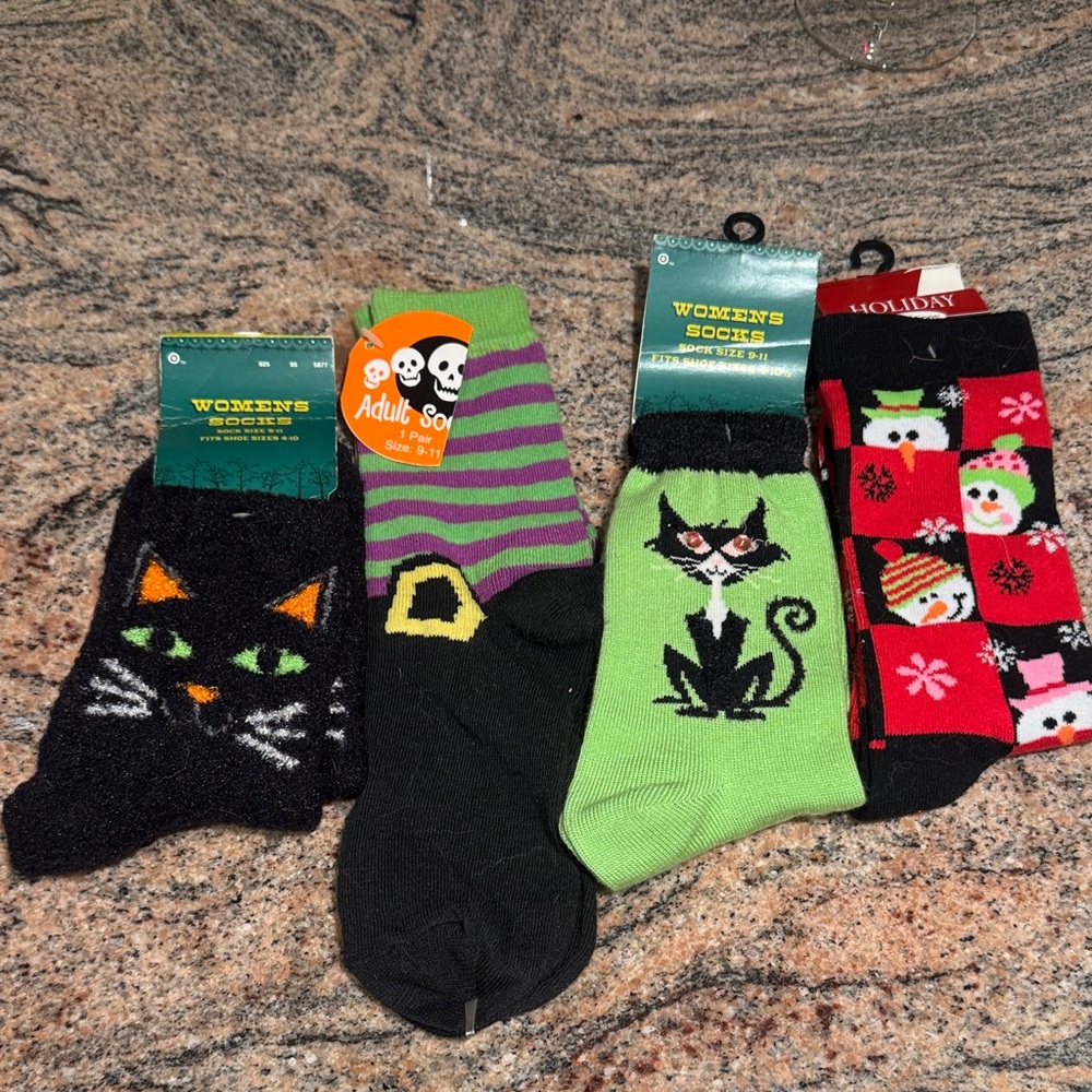 Set of 4 holiday socks. Christmas &Halloween Fits shoe size 4-10.Sock size 9-11